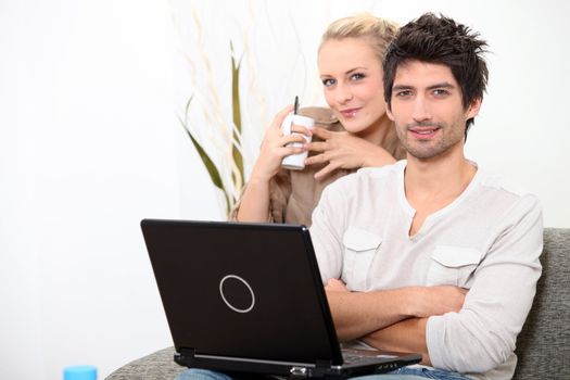 Couple relaxing at home on a Sunday morning