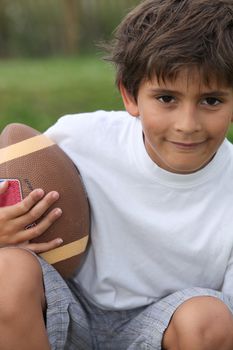 boy playing American football