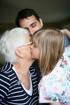 Child kissing her grandma