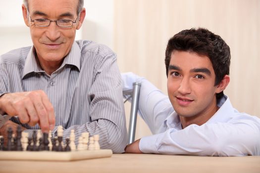 Father and son playing chess