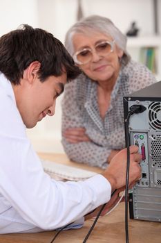 Teenager setting up computer