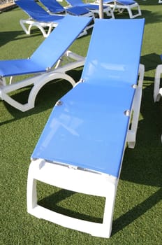 blue deckchair on the grass