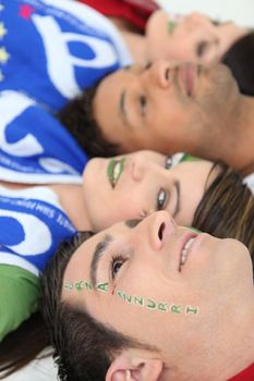 Italian football fans with Forza Azzurri facepaint
