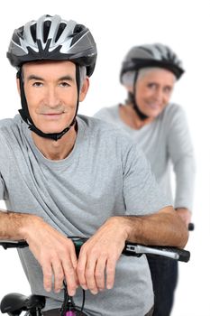 Elderly couple cycling