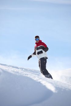 Man snowboarding alone