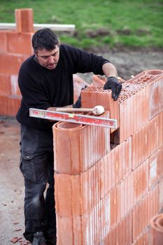 Mason building brick wall