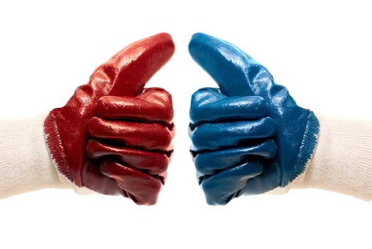 Two different color gloves gesturing a thumbs up sign 