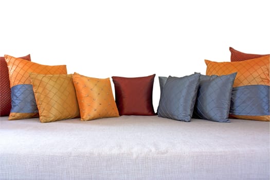 The colorful pillows scattered on the table.