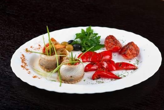 fillet of pikeperch stuffed with trout fish with baked pepper, tomato and leek
