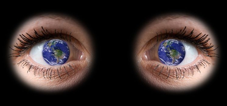 close up of a girl eyes with planet Earth into the pupil

