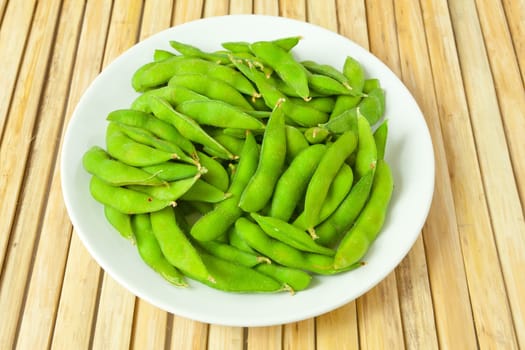 green bean vegetable on wood background