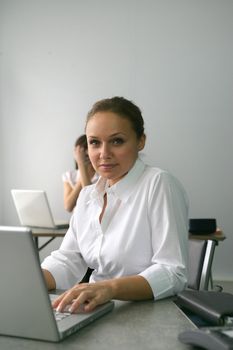 Businesswoman sat at her desk