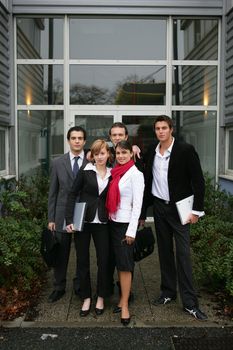 Young team outside an office building