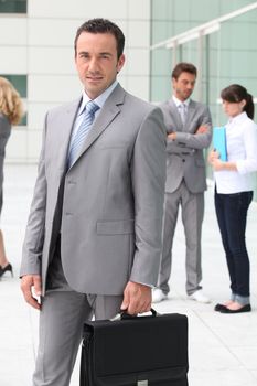 Man with briefcase outside office building