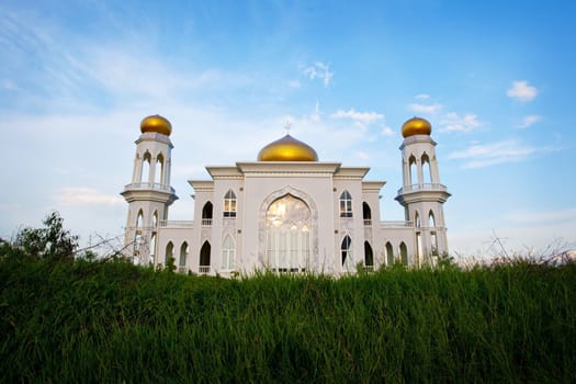 View of islamic mosque on sunset