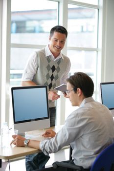Men at an office computer