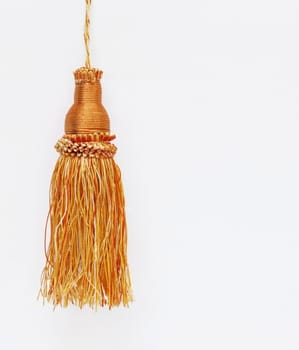 Gold christmas balls hanging on white background