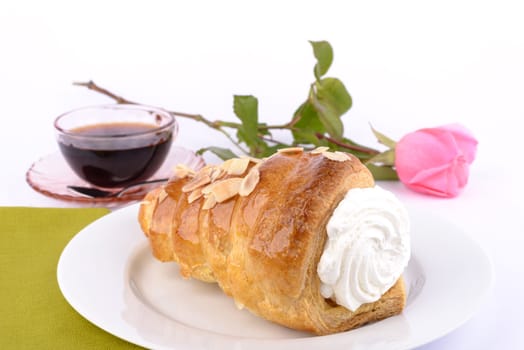 Cake almond with whipped cream isolated on white.