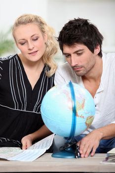 portrait of a couple with map of the world