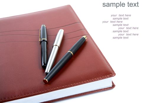 Leather organizer a fountain pen   (with sample text) on  white background