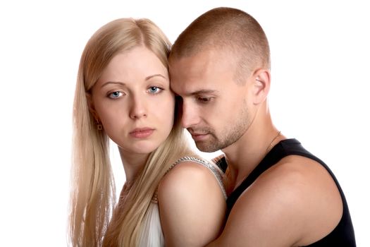 young man embraces the girl on a white background