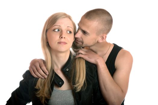 young man embraces the girl on a white background