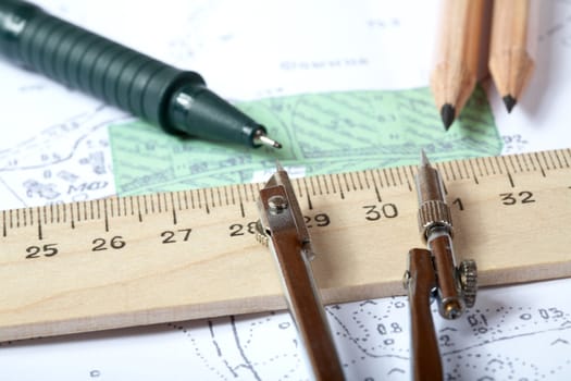Topographic map of district with  measuring instrument,  ruler and a pencil