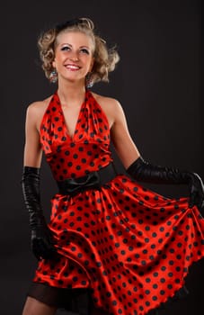 Young dancer woman in red dress.