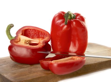 Paprika with a knife on a white background

