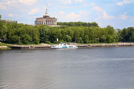 Landscape with steamship and river station in the afternoon