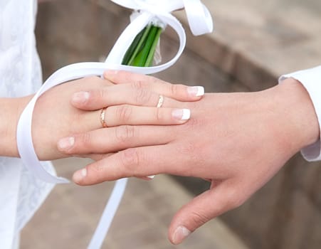 The weaved hands with rings of  bridegroom and  bride