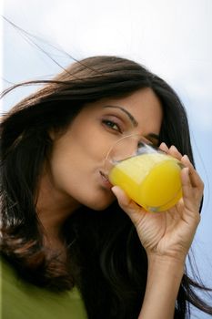 Gorgeous woman drinking orange juice
