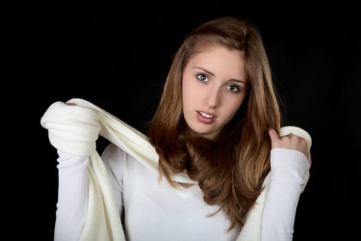 Portrait of the girl with a scarf on  black background