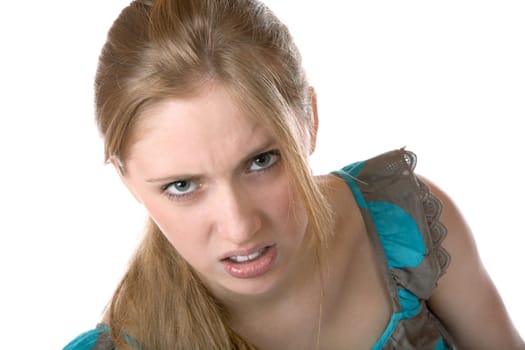 The girl shows discontent on a white background