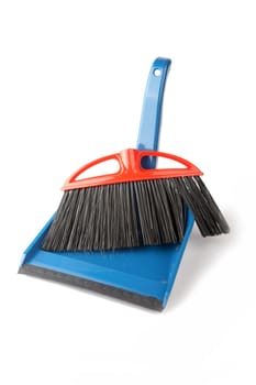 Scoop for dust and  brush on a white background