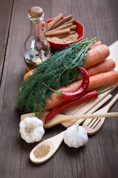 Spices and vegetables on an old wooden table