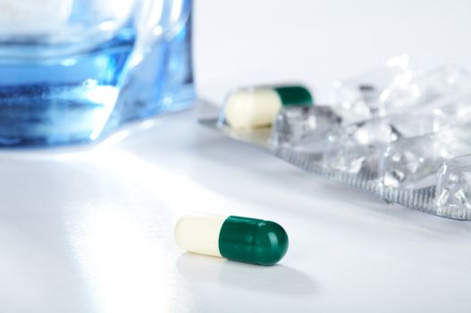 Medicines in capsules and blister on a table