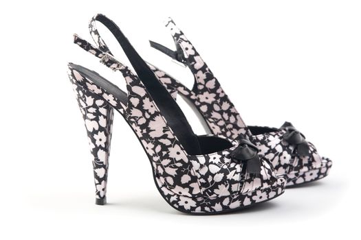 pair of female shoes on a high heel  white background