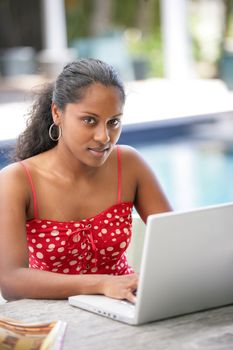 Sexy woman using her laptop