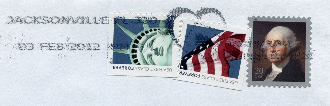 USA - CIRCA 2011: Stamps printed by USA post showing American patriotic symbols Statue of Liberty Flag and George Washington circa 2011 in USA
