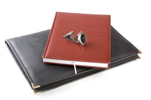Folder for papers, organizer and watch on a white background