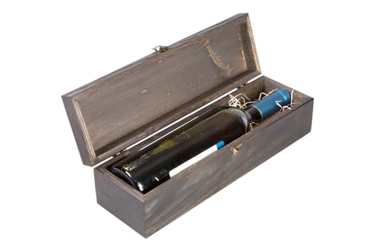 Wooden box with a bottle of wine on  white background