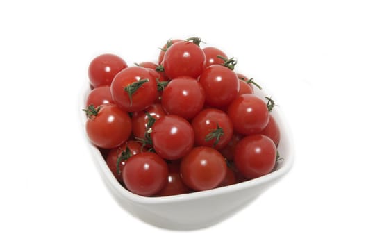 plate with cherry tomatoes on a white background