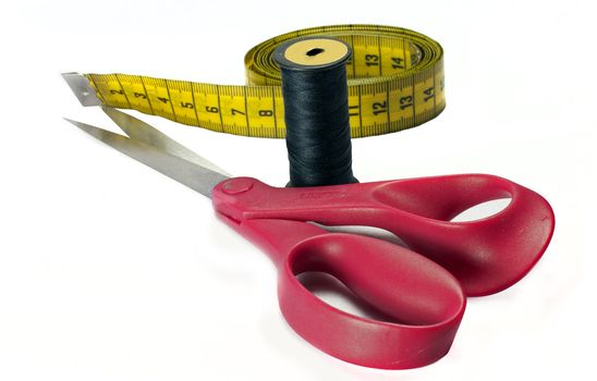pink scissors and measurement tool