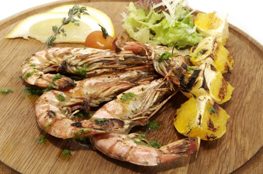 a large plate of shrimp and baked fruit