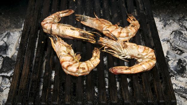Four royal shrimps roasted on the grill