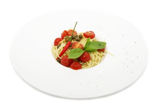 pasta with tomato and pepper on a plate on a white background
