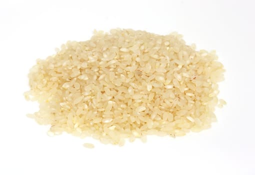 PILE OF BROWN RICE ISOLATED ON WHITE BACKGROUND 