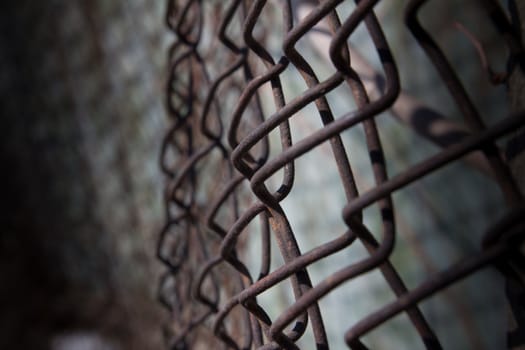 a rusty iron fence mesh