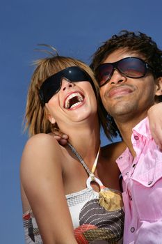 Couple laughing together in the sunshine